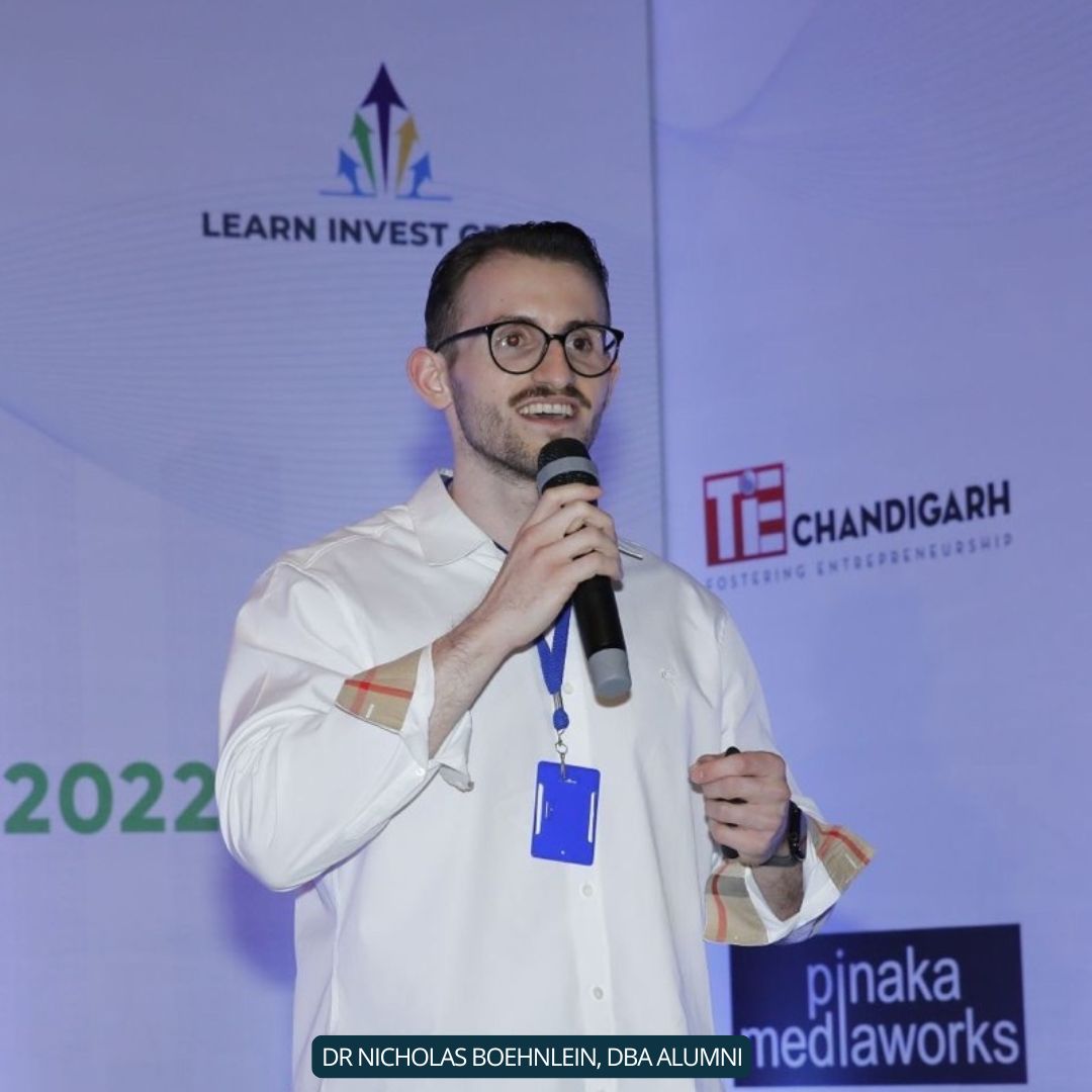 Dr. Nicholas, a DBA EBU alumnus, giving a speech.